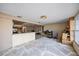 Spacious living area with kitchen and fireplace at 1409 Ne 49Th Ne Ave, St Petersburg, FL 33703