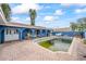 Rectangular pool needs cleaning, adjacent to house at 1409 Ne 49Th Ne Ave, St Petersburg, FL 33703