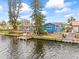 Back of waterfront house with dock and canal view at 1409 Ne 49Th Ne Ave, St Petersburg, FL 33703
