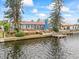 House on canal with dock and deck, offering water access at 1409 Ne 49Th Ne Ave, St Petersburg, FL 33703