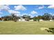 Spacious backyard with a view of the house and surrounding landscape at 17403 Estes Rd, Lutz, FL 33548