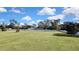 Expansive grassy backyard with a white fence at 17403 Estes Rd, Lutz, FL 33548