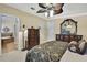 Spacious bedroom with king bed, dresser, and ensuite bathroom access at 17403 Estes Rd, Lutz, FL 33548