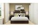 Cozy bedroom with a dark brown bed frame and accent pillows at 17716 Happytrails St, Land O Lakes, FL 34638