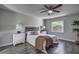 Main bedroom with wood-look floors and ceiling fan at 2042 Ridgelane Rd, Clearwater, FL 33755