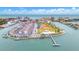 Aerial view of waterfront community with tennis courts and playground at 259 Medallion Blvd # B, Madeira Beach, FL 33708