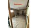 Empty bedroom undergoing renovation with tiled floors at 259 Medallion Blvd # B, Madeira Beach, FL 33708
