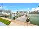 Community dock with boat slips and seating area, offering waterfront access at 259 Medallion Blvd # B, Madeira Beach, FL 33708
