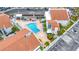 Communal pool area with lounge chairs and landscaping at 259 Medallion Blvd # B, Madeira Beach, FL 33708