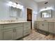 Double vanity bathroom with granite countertop at 30923 Burleigh Dr, Wesley Chapel, FL 33543