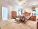 Main bedroom with wooden furniture and high ceilings at 30923 Burleigh Dr, Wesley Chapel, FL 33543