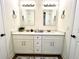 Double vanity bathroom with quartz countertop and mirrors at 4120 N Nebraska Ave, Tampa, FL 33603