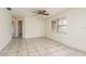 Empty bedroom with tiled floors and ceiling fan at 4481 Alligator Dr, New Port Richey, FL 34653