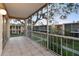 Screened balcony overlooking courtyard and trees at 4715 Michael Ct # 136, Tampa, FL 33614