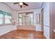 Spacious bedroom with mirrored closet and wood floors at 4961 Britni Way, Zephyrhills, FL 33541