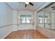 Bright bedroom with mirrored closet and wood floors at 4961 Britni Way, Zephyrhills, FL 33541