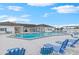 Relaxing community pool with plenty of lounge chairs at 4961 Britni Way, Zephyrhills, FL 33541