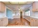 Spacious dining area with wood-look flooring and lots of natural light at 4961 Britni Way, Zephyrhills, FL 33541