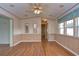 Bright dining area features wood-look flooring and a ceiling fan at 4961 Britni Way, Zephyrhills, FL 33541