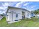 Exterior view of a manufactured home with storage shed at 4961 Britni Way, Zephyrhills, FL 33541