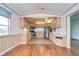 Bright kitchen features stainless steel appliances and wood-look flooring at 4961 Britni Way, Zephyrhills, FL 33541