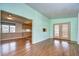 Living room with wood-look flooring and neutral walls at 4961 Britni Way, Zephyrhills, FL 33541
