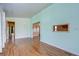 Living room with wood-look flooring and neutral walls at 4961 Britni Way, Zephyrhills, FL 33541