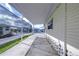 Covered patio with additional covered walkway at 4961 Britni Way, Zephyrhills, FL 33541
