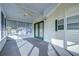 Bright and airy screened porch with ceiling fan at 4961 Britni Way, Zephyrhills, FL 33541
