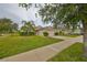 House exterior with driveway and lawn at 529 Laguna Mill Dr, Ruskin, FL 33570