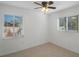 Well-lit bedroom featuring tile floors and window blinds at 920 Hull S St, Gulfport, FL 33707