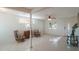 Bright living room with tiled floors and two comfy armchairs at 920 Hull S St, Gulfport, FL 33707