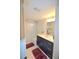 Updated bathroom with modern vanity, fixtures, and a shower/tub combo at 920 Virginia St # 204, Dunedin, FL 34698