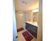 Updated bathroom with modern vanity, fixtures, and a shower/tub combo at 920 Virginia St # 204, Dunedin, FL 34698