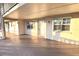Exterior elevation of a home with a covered walkway, front door, and windows with shutters at 920 Virginia St # 204, Dunedin, FL 34698