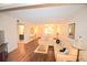 Living room with a tan couch, coffee table, and wood-look flooring at 920 Virginia St # 204, Dunedin, FL 34698
