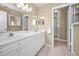 Bathroom featuring double sinks, white cabinetry, and neutral color palette at 100 Bluff View Dr # 207C, Belleair Bluffs, FL 33770