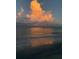 Seascape view of the ocean at sunset with dramatic clouds reflecting in the water at 100 Bluff View Dr # 207C, Belleair Bluffs, FL 33770