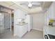 White kitchen with lots of cabinet space and updated appliances at 100 Bluff View Dr # 207C, Belleair Bluffs, FL 33770