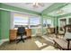 Home office with large window to lake, ceiling fan and closet at 100 Bluff View Dr # 207C, Belleair Bluffs, FL 33770