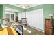 Home office with ample closet space, mirrored wall, and rocking chair at 100 Bluff View Dr # 207C, Belleair Bluffs, FL 33770