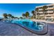 Inviting community pool with ample space for lounging and swimming at 100 Bluff View Dr # 207C, Belleair Bluffs, FL 33770
