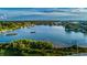Aerial view of a neighborhood on the water with docks at 100 Bluff View Dr # 207C, Belleair Bluffs, FL 33770