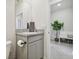Small bathroom with granite countertop and vanity at 10058 Shoreline View Way, Wesley Chapel, FL 33545