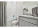 Clean bathroom with shower/tub combo and granite vanity at 10058 Shoreline View Way, Wesley Chapel, FL 33545