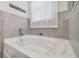 Relaxing bathroom with soaking tub and tile surround at 10058 Shoreline View Way, Wesley Chapel, FL 33545
