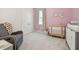 Bedroom with crib and rocking chair at 10058 Shoreline View Way, Wesley Chapel, FL 33545