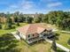 Aerial view of a beautiful single-Gathering home on expansive acreage at 10058 Shoreline View Way, Wesley Chapel, FL 33545