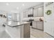 Modern kitchen featuring granite countertops and gray cabinets at 10058 Shoreline View Way, Wesley Chapel, FL 33545