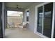 Relaxing screened-in lanai with comfortable seating, perfect for enjoying the outdoors at 10058 Shoreline View Way, Wesley Chapel, FL 33545